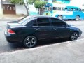 mitsubishi-lancer-es-2006-small-0